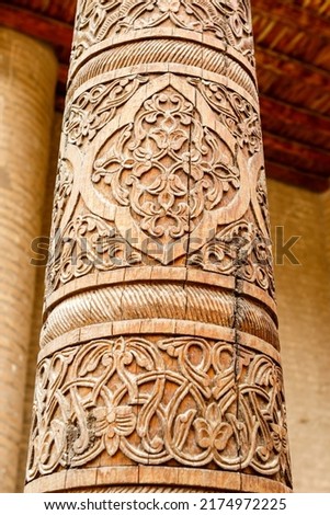 Carved wooden pillar of the Ark citadel in Khiva, Uzbekistan, Central Asia