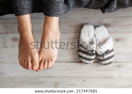 Soft photo of woman feet with slippers, top view point Royalty-Free Stock Photo #217497685