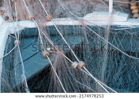 fishing net with float line or fish nets with small plastic floats on wooden fisherman boat, fineart picture