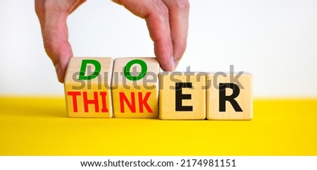 Doer or thinker symbol. Concept words Doer or thinker on wooden cubes. Businessman hand. Beautiful yellow table white background. Business and doer or thinker concept. Copy space. Royalty-Free Stock Photo #2174981151