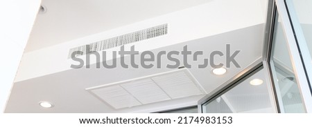 Ceiling mounted cassette type air conditioner. Interior ceiling concept.