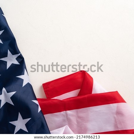 Concept of U.S Independence day or Memorial day. National flag over bright marble table background.