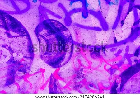 Closeup of colorful pink, purple, blue urban wall texture. Modern pattern for wallpaper design. Creative modern urban city background for advertising mockups. Grunge messy street style background Royalty-Free Stock Photo #2174986241