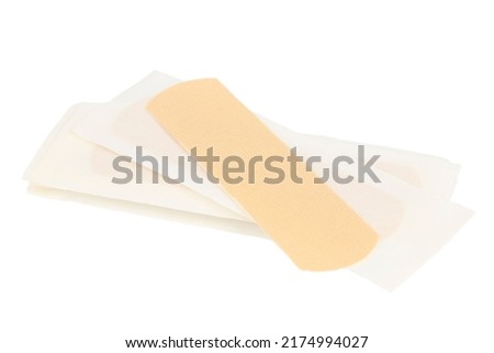 Brown sticky medical plaster on a white background.