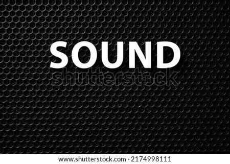 Inscription sound. Safety net on the music speaker. Protective grid audio speakers. Black safety net. Metal perforated mesh, abstract pattern, Abstract black background. Professional audio equipment Royalty-Free Stock Photo #2174998111