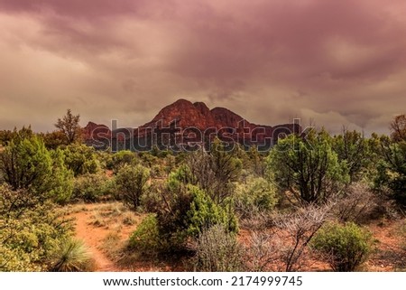 Dark clouds add to beauty to the red rock scenery of Sedona, AZ, USA