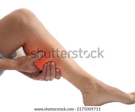Adult man holding leg muscle pain and numbness from muscle cramps isolated on white background with copy space for text. Calf muscle pain in runner.