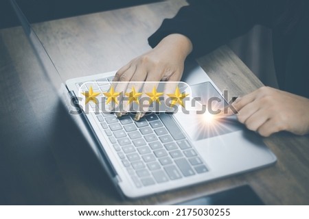 Customer service and Satisfaction concept woman hands doing online assessments in the satisfaction rating the popular service company allows customers in order to improve and develop the organization