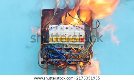 Accident involving electrics, fire caused by electrical faults include old unsafe fuse board. Royalty-Free Stock Photo #2175031935