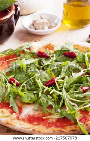 Pizza with rocket and chillies