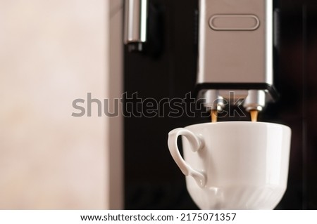 Making fresh aroma coffee with espresso machine in cold evening