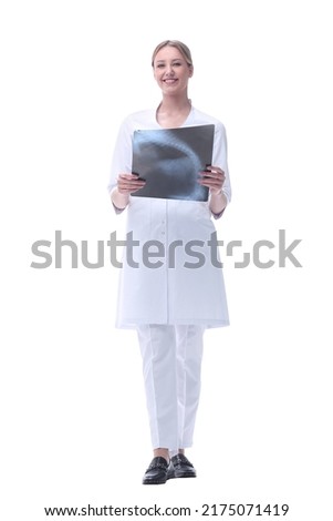 competent woman doctor looking at x-ray. isolated on white