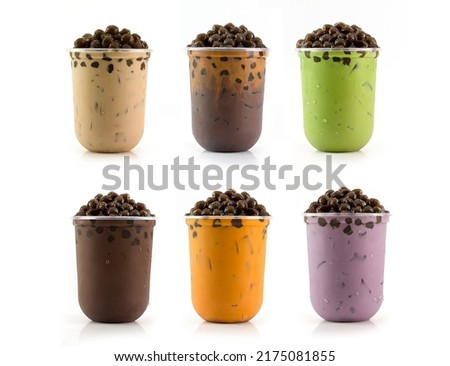 Various flavored bubble tea drinks on a white background