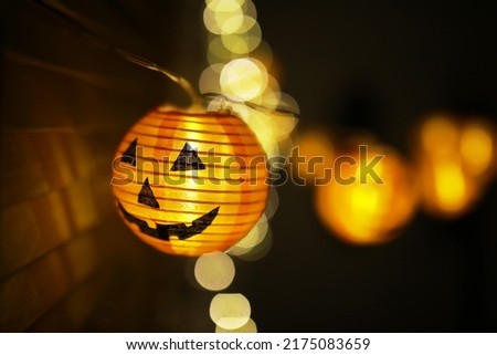 The concept of light on the night Halloween.Round lamp shape of pumpkin used to decorate with copy space for text.
