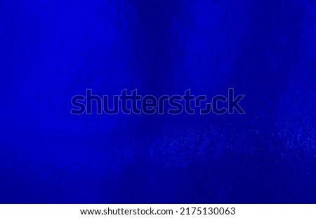 Blue foil background with uneven texture Royalty-Free Stock Photo #2175130063