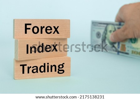 wooden blocks with the words Forex, index, trading, Concept, non-stock currency market, money exchange of the most important world institutions
