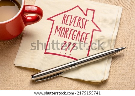 reverse mortgage question - writing and sketch on a napkin, finance and retirement concept Royalty-Free Stock Photo #2175155741