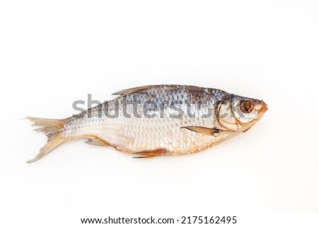 Dry fish. Seafood snack for beer. Salted sun-dried, jerked or smoked fish. Taranka, vobla. Russian or Ukrainian food. Caspian roach fish. Dead fish. High resolution photo. On white background