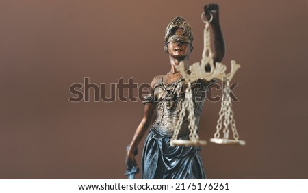 Legal and law concept statue of Lady Justice on blurred background