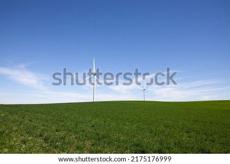 Wind turbines in rural farm setting