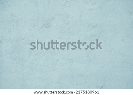 Light blue teal background image of plastered wall. Abstract loft Texture. Vintage concrete Textured rough Surface. Beautiful delicate Wallpaper With Copy Space for design
