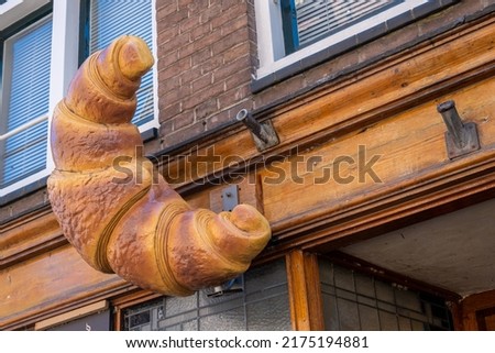 Giant croissant on the facade of a bakery