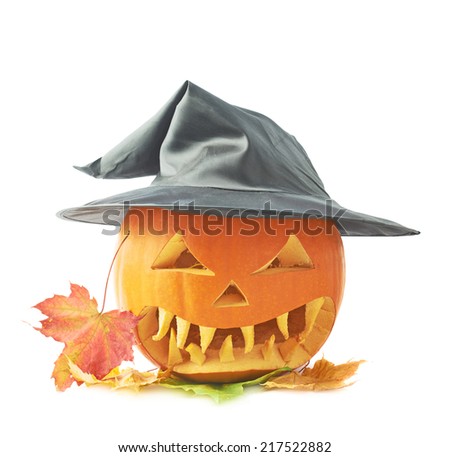Jack-o'-lanterns orange pumpkin head in a black pointed cone shaped wizard's hat over a pile of colorful maple leaves, composition isolated over the white background