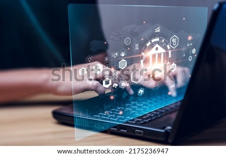 Businessman using online banking on laptop and making payments. Digital marketing.Finance and banking networking.Online shopping and customer network connection icons,Cybersecurity.Business technology Royalty-Free Stock Photo #2175236947
