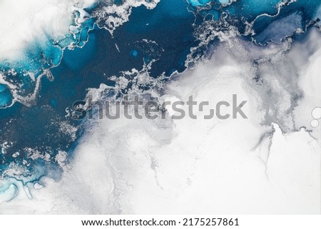 Marble ink abstract art from exquisite original painting for abstract background . Painting was painted on high quality paper texture to create smooth marble background pattern of ombre alcohol ink . Royalty-Free Stock Photo #2175257861