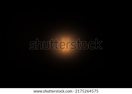 soft warm glow of the lamp on a dark background