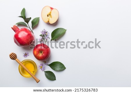 Flat lay composition with symbols jewish Rosh Hashanah holiday attributes on colored background, Rosh hashanah concept. New Year holiday Traditional. Top view with copy space. Royalty-Free Stock Photo #2175326783