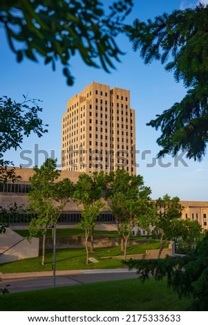 The North Dakota State Capitol, pictured here from the Capitol Grounds Native Prairie at Bismarck, is a 21-story Art Deco tower that is the tallest habitable building in the state.  
