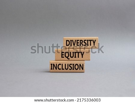 Diversity Equity Inclusion symbol. Concept words Diversity Equity Inclusion on wooden blocks. Beautiful grey background. Business and Diversity Equity Inclusion concept. Copy space