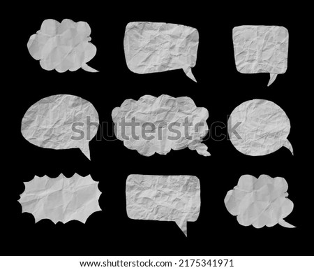 White crumpled paper texture in bubble speech shape. Set of balloon text isolated in black background. Royalty-Free Stock Photo #2175341971