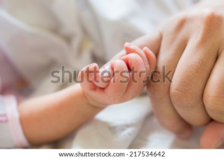 New born baby hand Royalty-Free Stock Photo #217534642