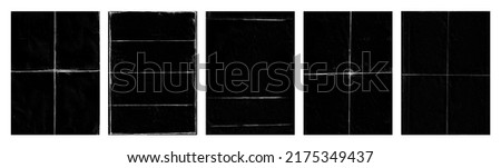 Set of folded paper with grungy texture in black background. can be used to replicate the aged and worn look for your creative design. old paper for photo texture overlay in retro style Royalty-Free Stock Photo #2175349437