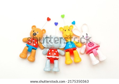 A set of plastic toys for newborns. Colorful rattles on white background. Baby toys for newborn babies