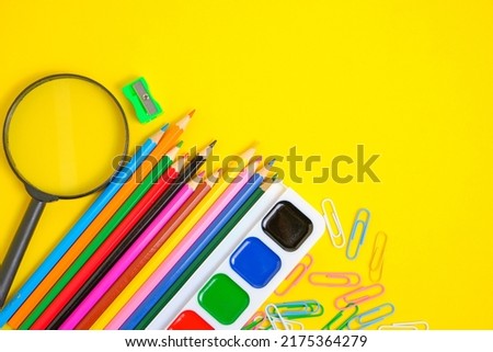 School supplies and stationery yellow background.Preparing child for school