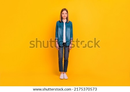 Full size photo of cheerful satisfied girl standing have good mood isolated on bright yellow color background