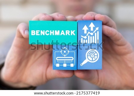Concept of benchmark indicators improvement and achievement. Idea of business development and improvement. Compare quality with competitor companies. Benchmarking concept. Royalty-Free Stock Photo #2175377419