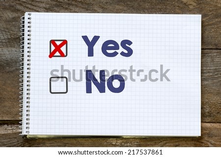 Notebook with checklist on table,Yes or no decision