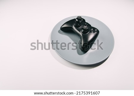 Gamepad on a plate. food during the games