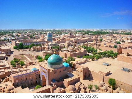 Beautiful aerial view of the 2500-year-old uzbek city Khiva. Ancient Itchan Kala fortress, Mosque, market and houses in Historic Center of Khiva  (UNESCO World Heritage Site), Uzbekistan, Central Asia Royalty-Free Stock Photo #2175392395