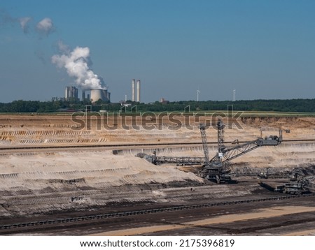 Hambach opencast lignite mine in the Rhenish lignite mining area in Germany, Aerial with power plant in background Royalty-Free Stock Photo #2175396819