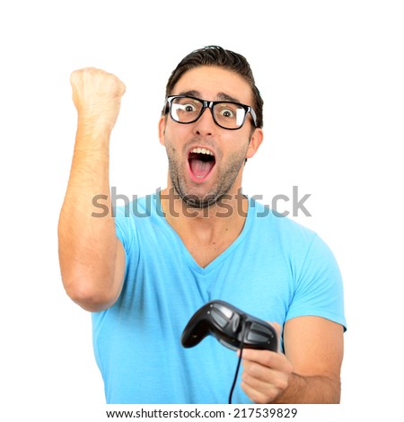 Portrait of handsome man holding joystick for video games against white background