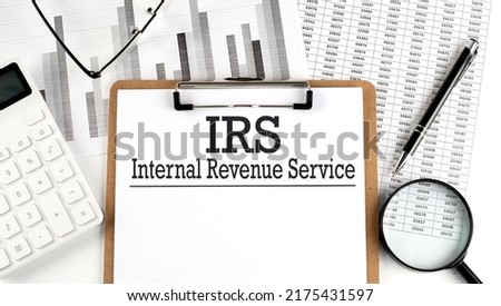 Paper with IRS - Internal Revenue Service table on a charts, business concept