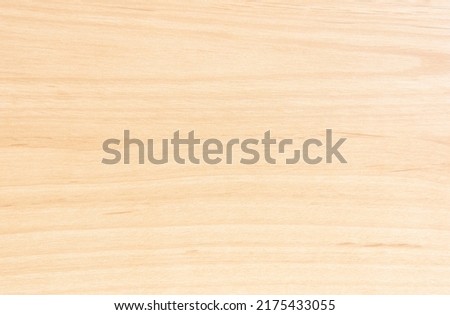 Natural wood grain background with horizontal lines.