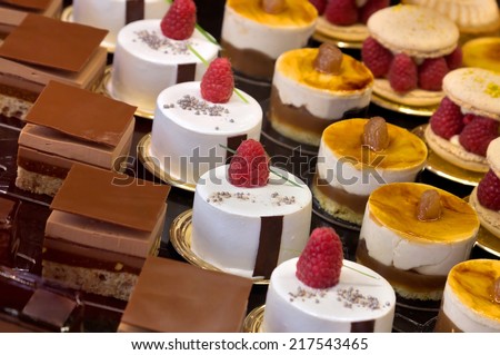 Chocolate cakes on display a confectionery shop in France. Royalty-Free Stock Photo #217543465