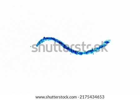 Blue color crayon hand drawing in curved line shape on white paper background