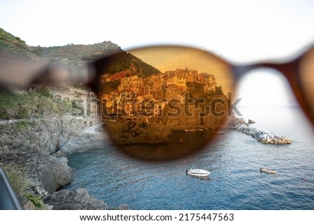 Looking trough Sunglasses at Manarola, famous Town in 5 terre, Italy.